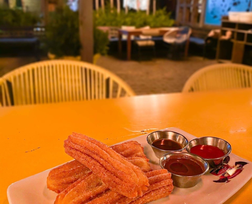 El Catrin’s famous churros with a side of three dips