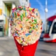 Pandoughra’s box birthday cake cookie dough in red ice cream cone with streetcar and CN Tower in background