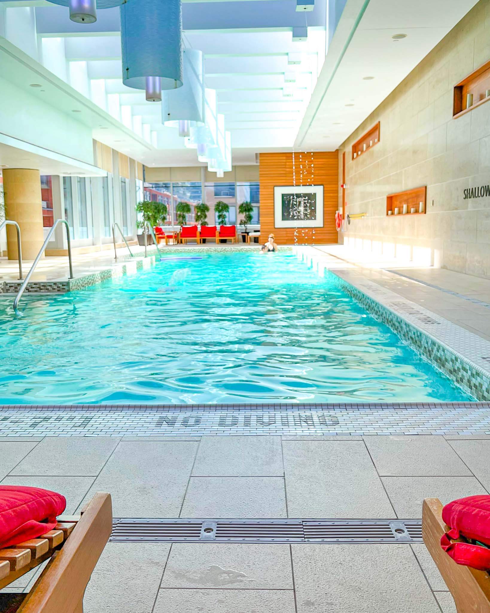 Shangri-La Toronto poolside, cascading water, pool chairs